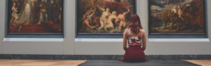 Woman sitting in art gallery banner